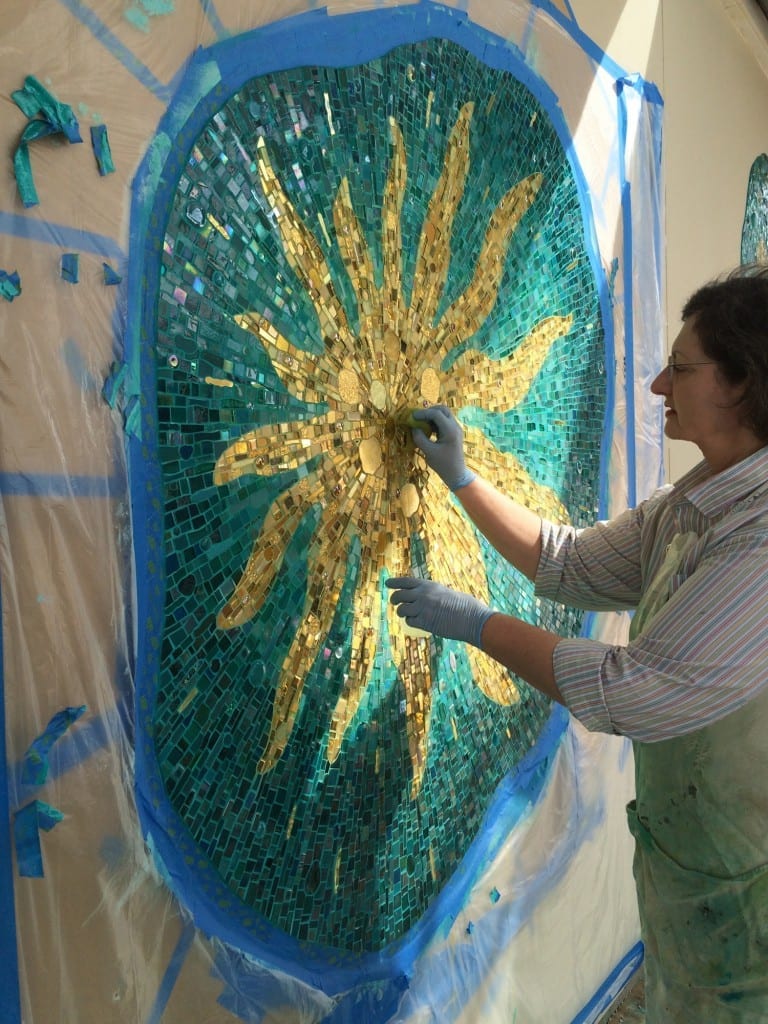 Sonia King cleaning 'VisionShift' during installation